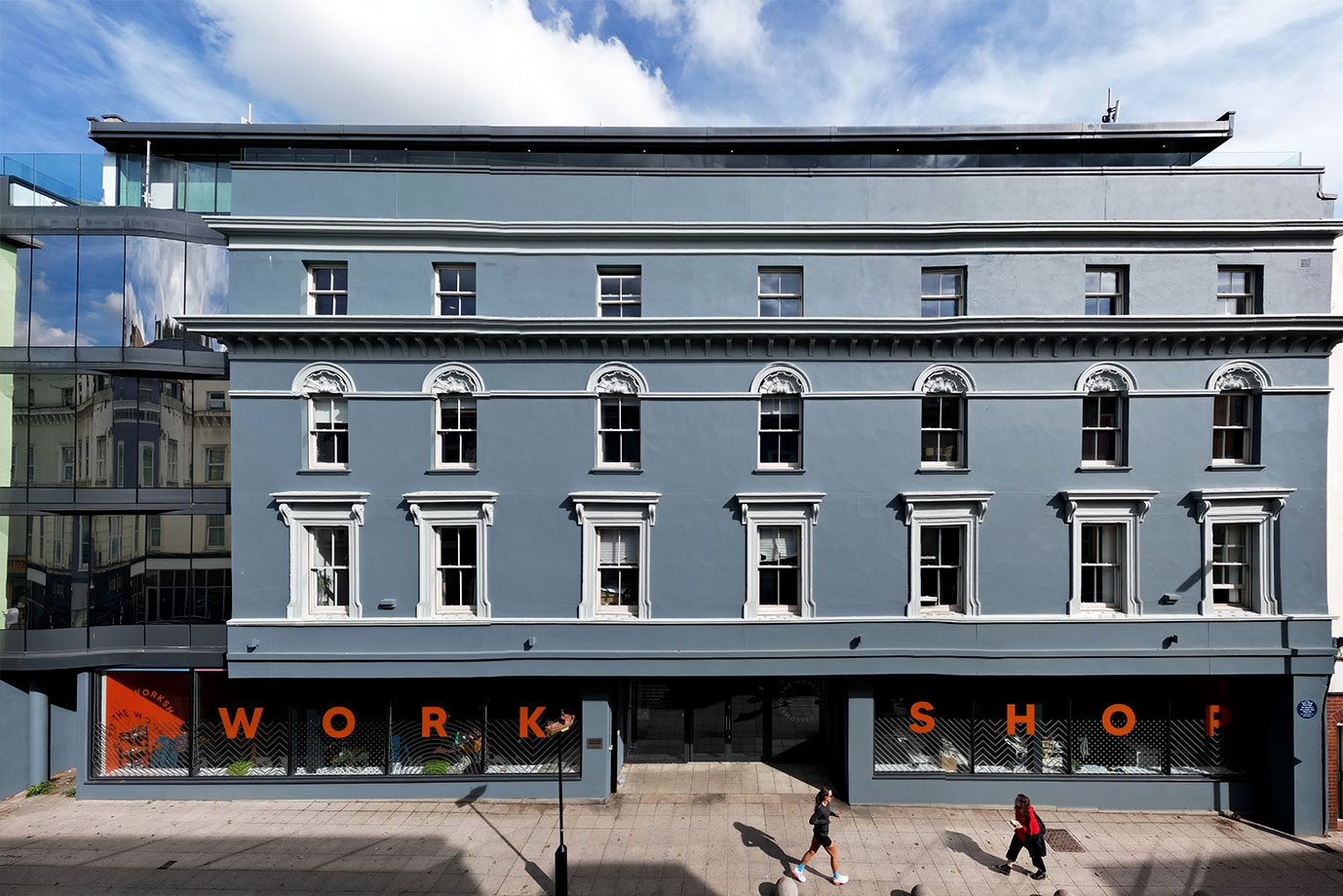 The Workshop's repainted front at 32-40 Tontine Street, Folkestone, with WORKSHOP across the windows